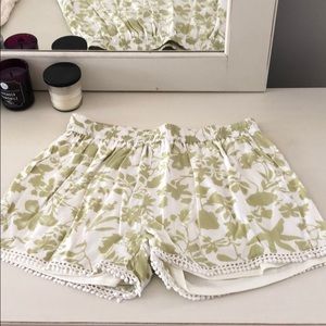 Green and white shorts with flower pattern